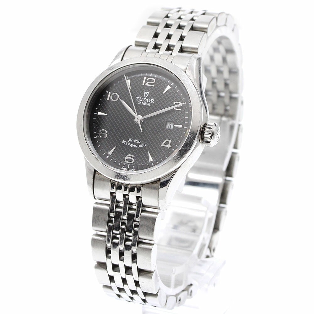 TUDOR 1926 Date Automatic Stainless Steel Women's Wristwatch: TUDOR 1926 Date Automatic Stainless Steel Women's Wristwatch This Tudor 1926 Date Automatic women's wristwatch features a stainless steel case and bracelet with a black dial. The watch is powered by a