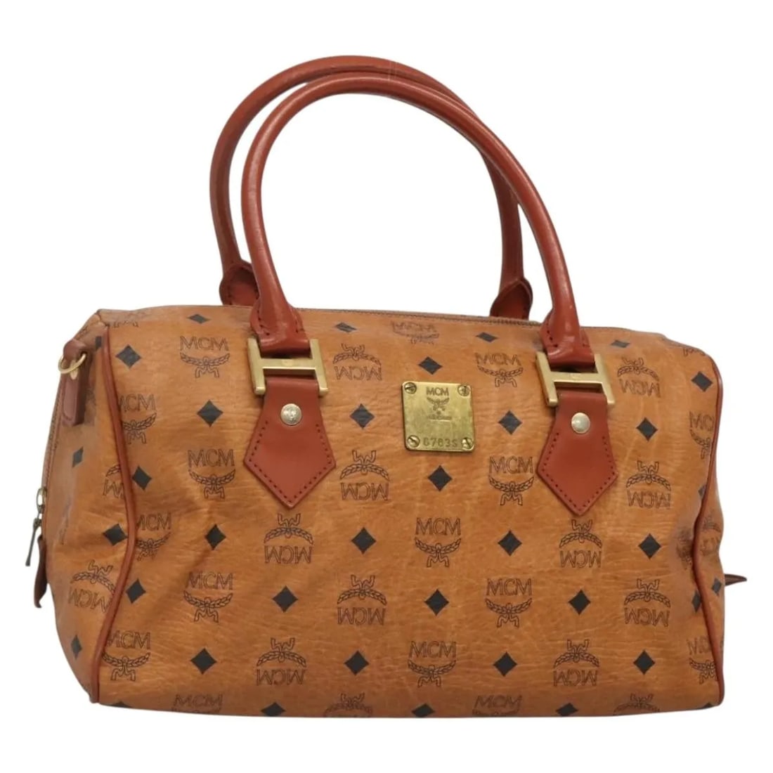 MCM Visetos Brown PVC Handbag with Leather Accents: MCM Visetos Brown PVC Handbag with Leather Accents This MCM Visetos handbag features a brown PVC exterior with leather accents, designed for women. The bag has a structured silhouette with handles, sh