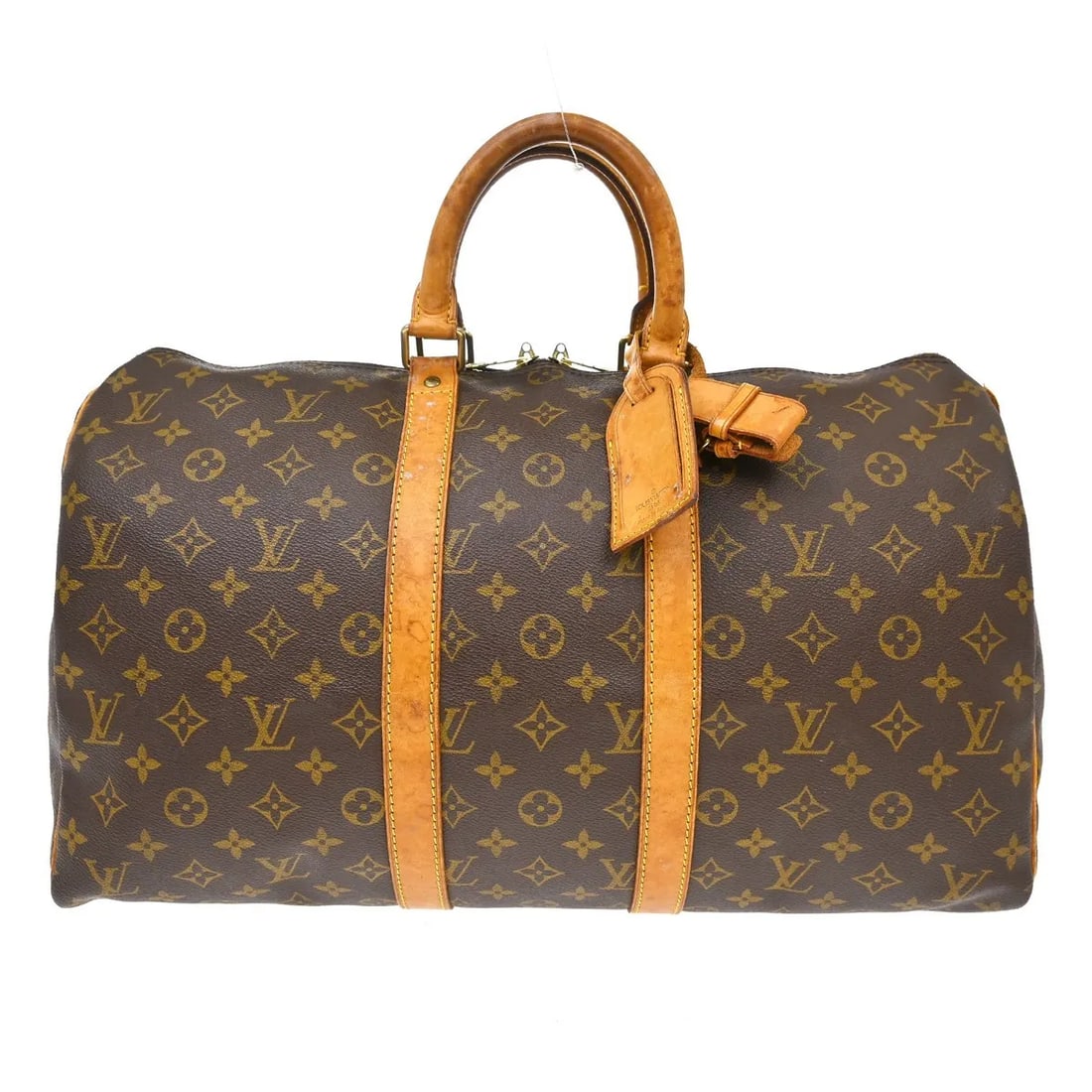Louis Vuitton Keepall Unisex Brown Canvas Travel Bag: Louis Vuitton Keepall Unisex Brown Canvas Travel Bag Vintage Louis Vuitton Keepall in brown monogram canvas. This unisex travel bag is presented in fair condition with visible wear throughout. The ext