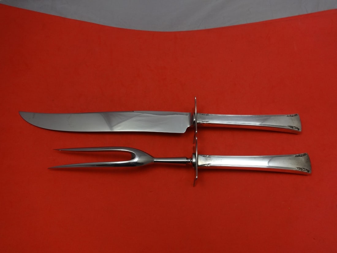 Serenity International Sterling Silver Carving Set 2pc Knife & Fork: Serenity International Sterling Silver Carving Set 2pc Knife & Fork Enhance your dining experience with this exquisite Serenity by International Sterling Silver Roast Carving Set. This two-piece set f