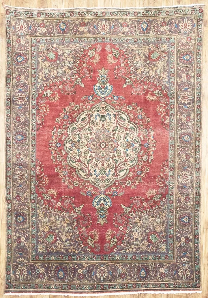 Hand-Knotted Wool Floral Oriental Area Rug 7'10 x 11'5: Hand-Knotted Wool Floral Oriental Area Rug 7'10 x 11'5 This semi-antique Oriental rug features a classic floral pattern in muted tones of plum, light green, light blue, and brown. Expertly hand-knotte