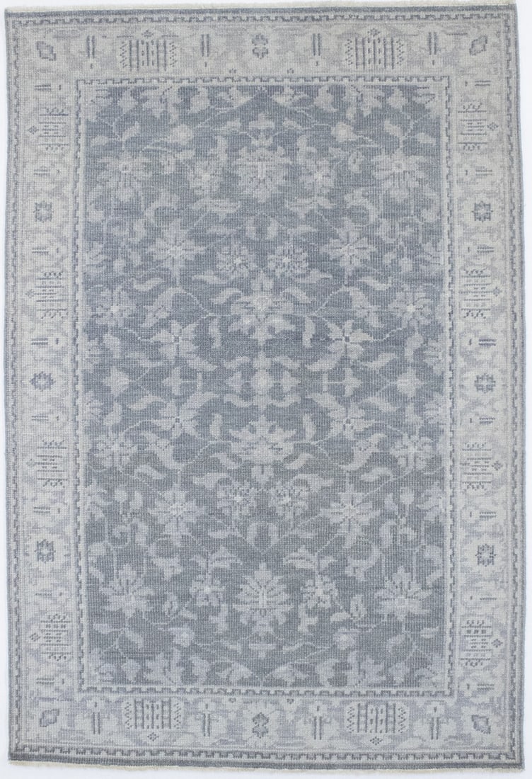 Muted Hand-Knotted Wool Rug 5'4 x 7'9 Transitional Floral Design: Muted Hand-Knotted Wool Rug 5'4 x 7'9 Transitional Floral Design This hand-knotted wool area rug features a muted transitional oriental design with floral patterns and modern influences. Crafted in In