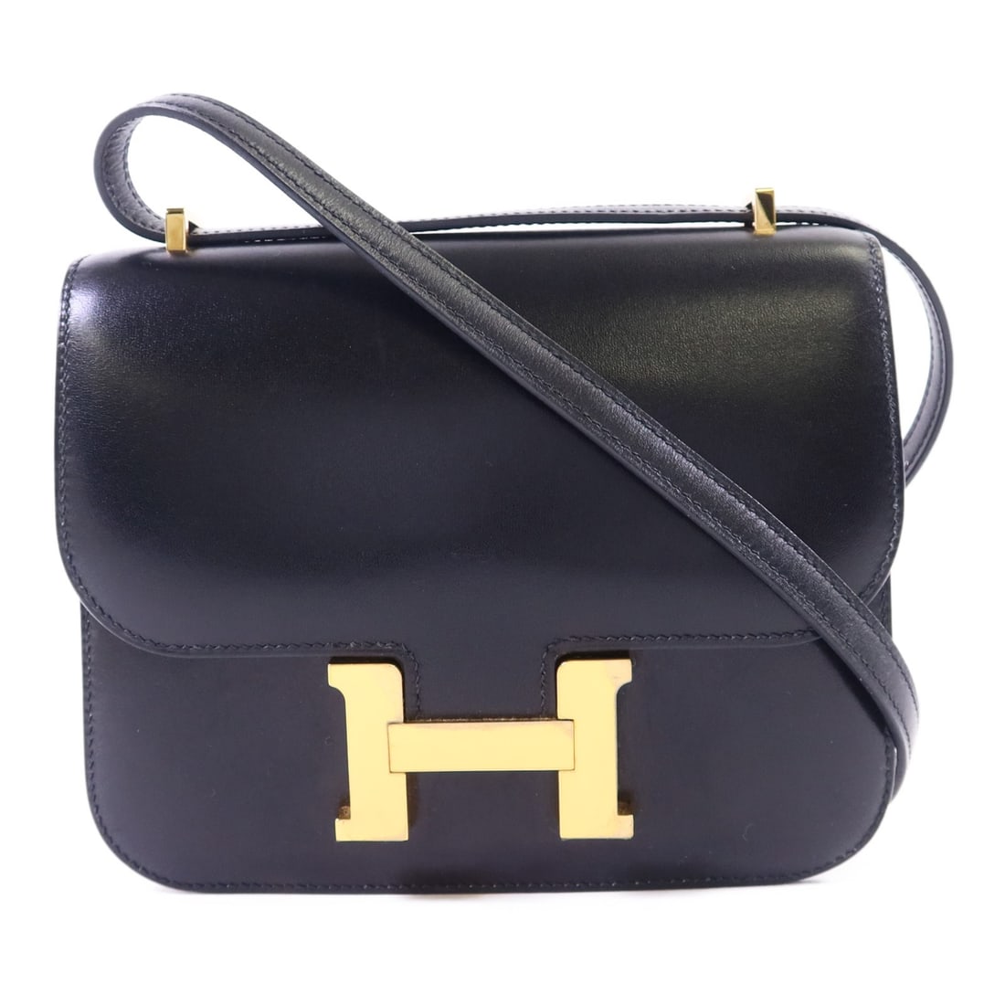 Hermes Constance Mini Black Box Calf Leather Shoulder Bag with Gold Hardware: Hermes Constance Mini Black Box Calf Leather Shoulder Bag with Gold Hardware This Hermes Constance Mini shoulder bag is crafted from black calfskin leather and features a compact, elegant silhouette. 