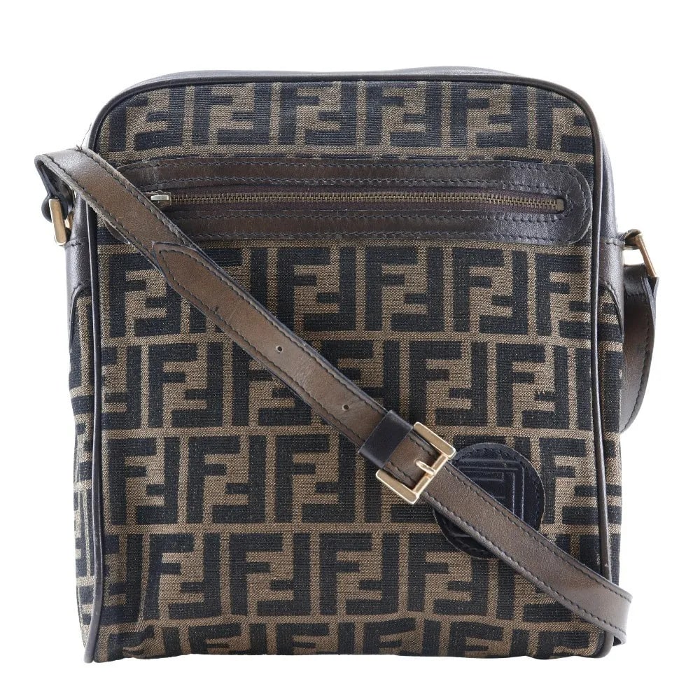 Fendi Logo Zucca Canvas Shoulder Bag Brown 22cm x 27cm x 7cm: Fendi Logo Zucca Canvas Shoulder Bag Brown 22cm x 27cm x 7cm This Fendi Logo Zucca Shoulder Bag features a brown canvas exterior with the iconic Zucca print. Designed for unisex use, the bag exhibits 