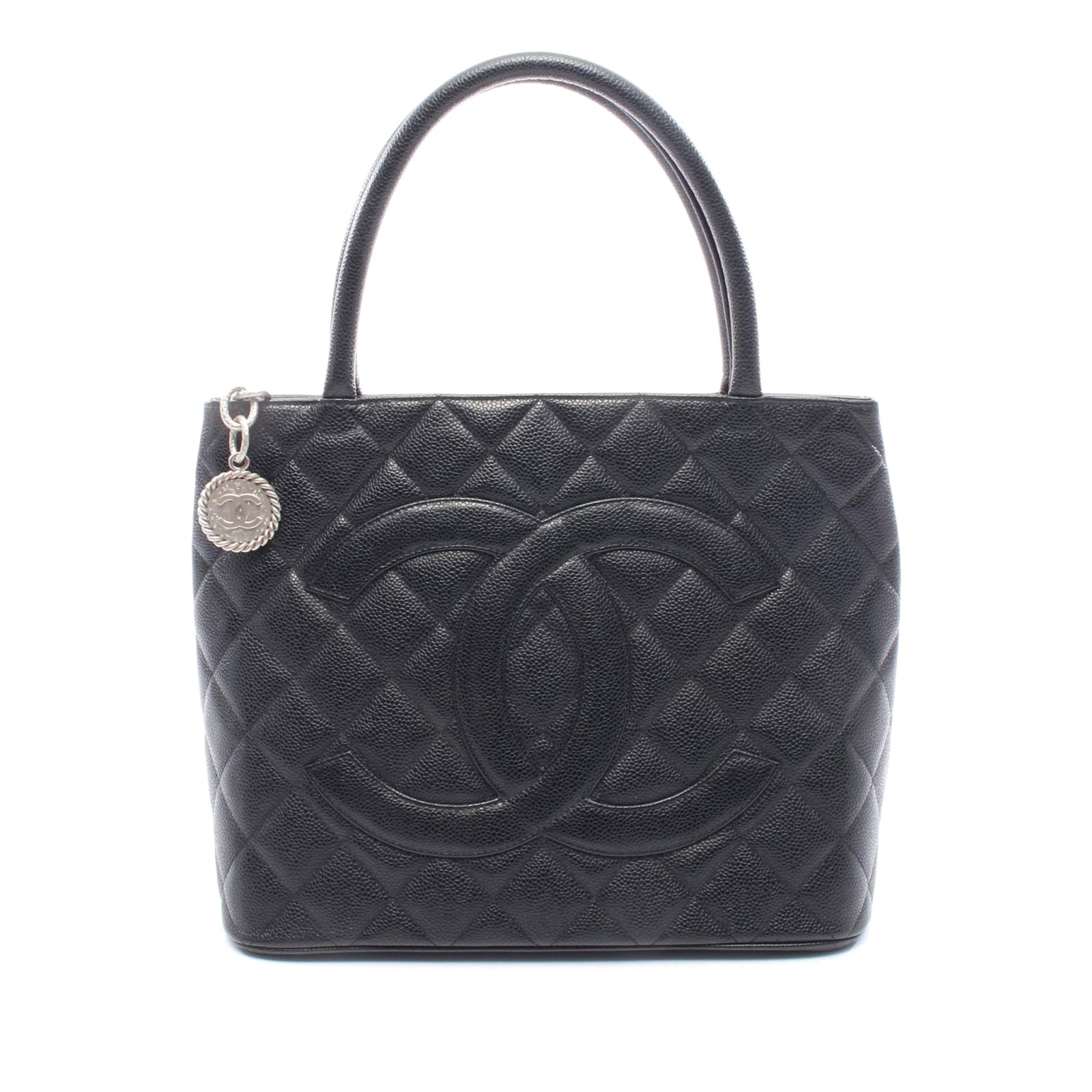 Chanel black caviar leather Medallion tote bag: Chanel black caviar leather Medallion tote bag This Chanel Caviar Medallion Tote features a quilted caviar leather body in black, rolled leather handles, a top zip closure, an exterior back slip pocke