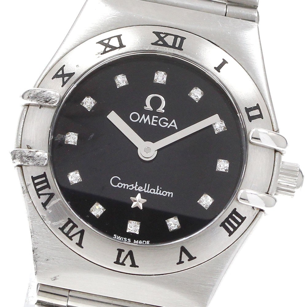 Omega Constellation Mini 1562.56 Women's Quartz Steel Watch: Omega Constellation Mini 1562.56 Women's Quartz Steel Watch This OMEGA Constellation Mini ladies' wristwatch features a stainless steel case and bracelet with a black dial. Powered by a quartz movemen