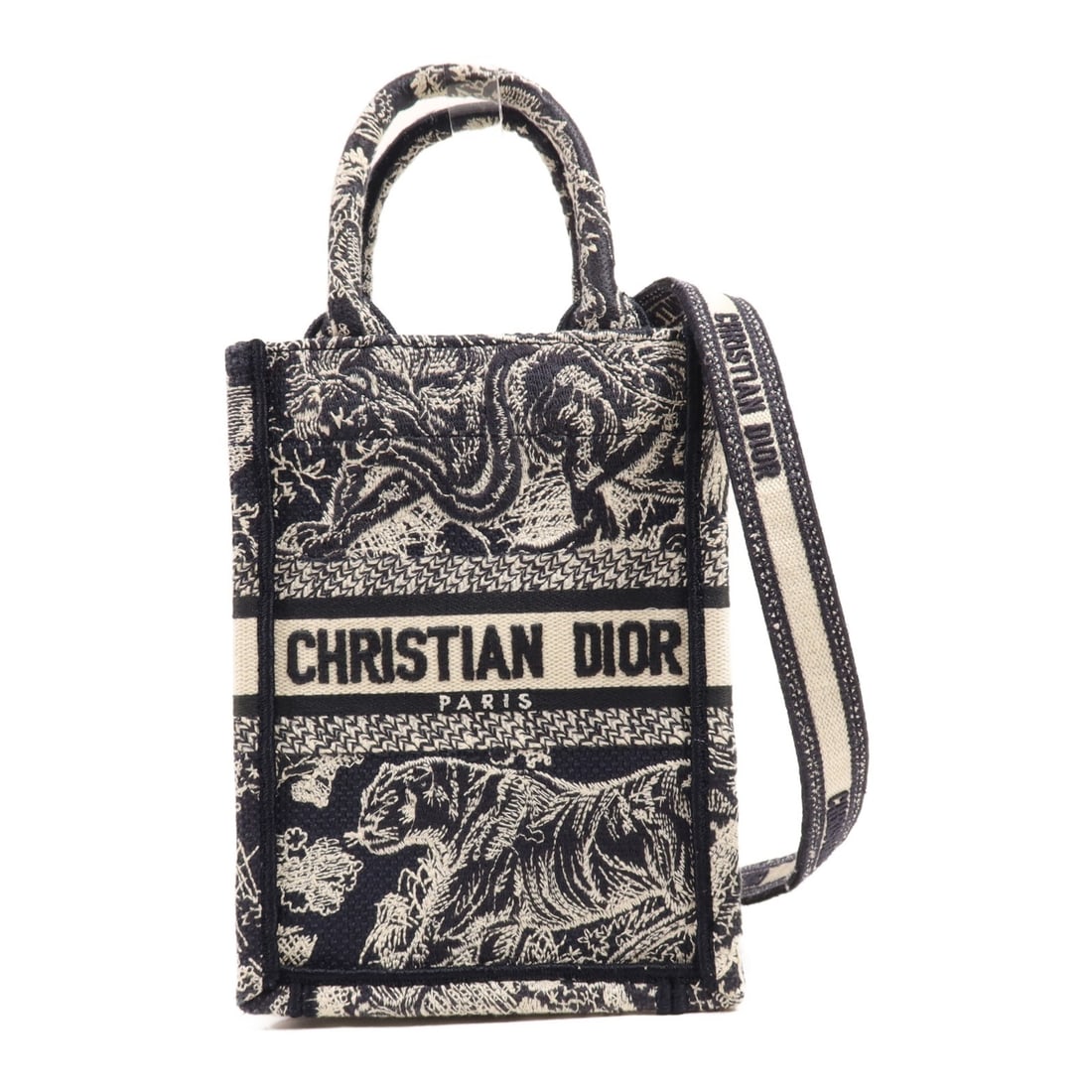 Dior Book Tote Mini Navy Canvas 2 Way Shoulder Bag GHW: Dior Book Tote Mini Navy Canvas 2 Way Shoulder Bag GHW This Christian Dior Book Tote Mini 2 Way Bag is crafted from navy canvas and features gold-tone hardware. Designed for versatility, it can be car