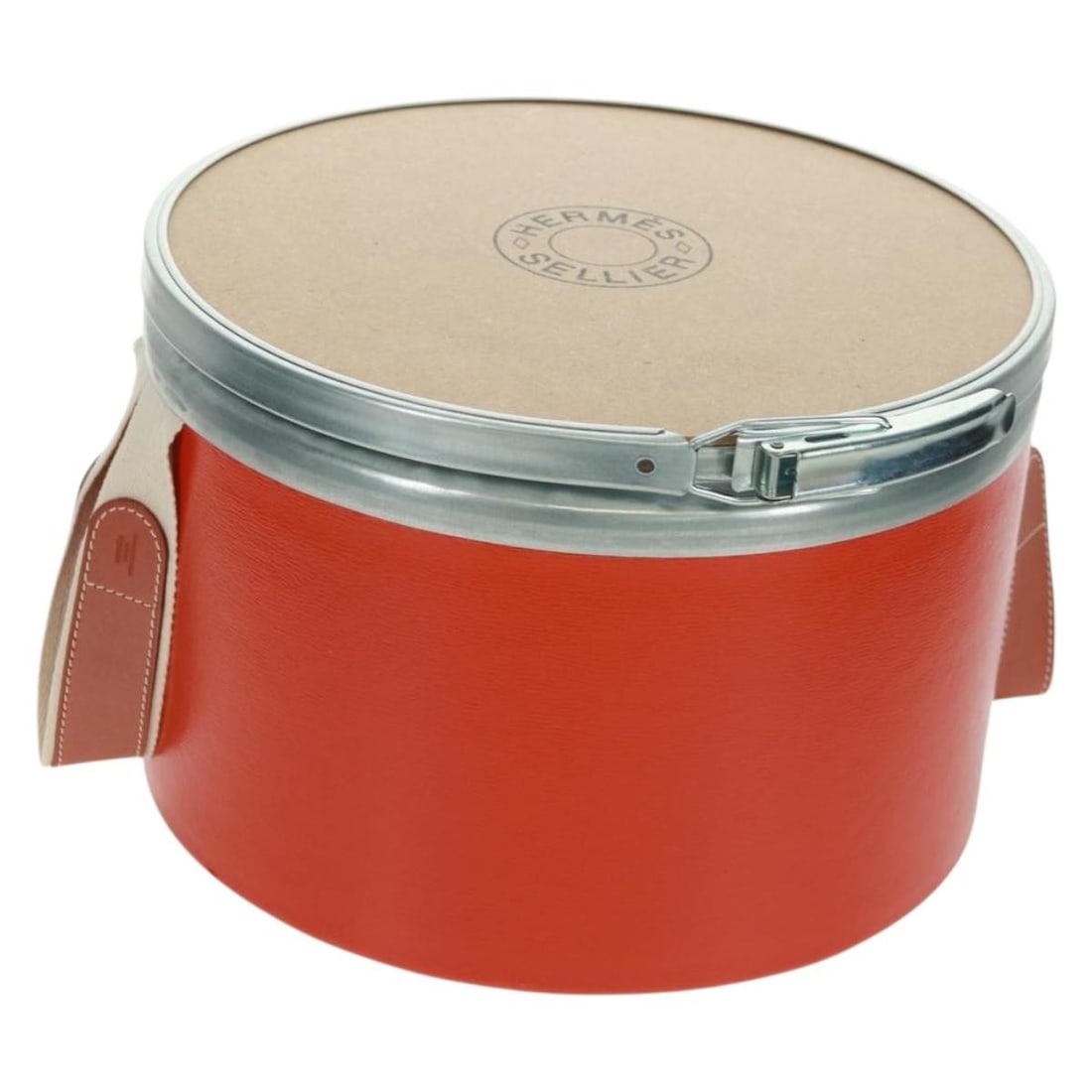Orange Metal Accessory Case by Hermes Saddle Box Design: Orange Metal Accessory Case by Hermes Saddle Box Design This Hermes accessory case features a sturdy metal construction in a vibrant orange hue. Designed in a saddle box shape, it offers a modern, fun