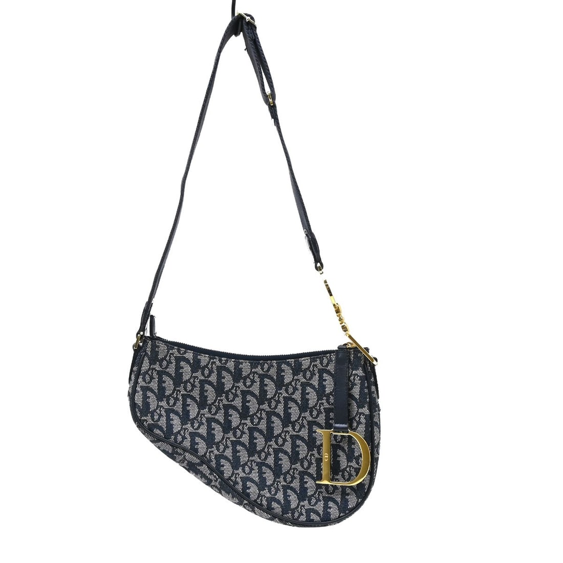 Dior Saddle Shoulder Bag in Navy Canvas Medium 08RU 1004: Dior Saddle Shoulder Bag in Navy Canvas Medium 08RU 1004 Christian Dior Saddle shoulder bag in navy canvas with a zip closure and adjustable shoulder strap. Made in Italy, this medium bag shows visibl