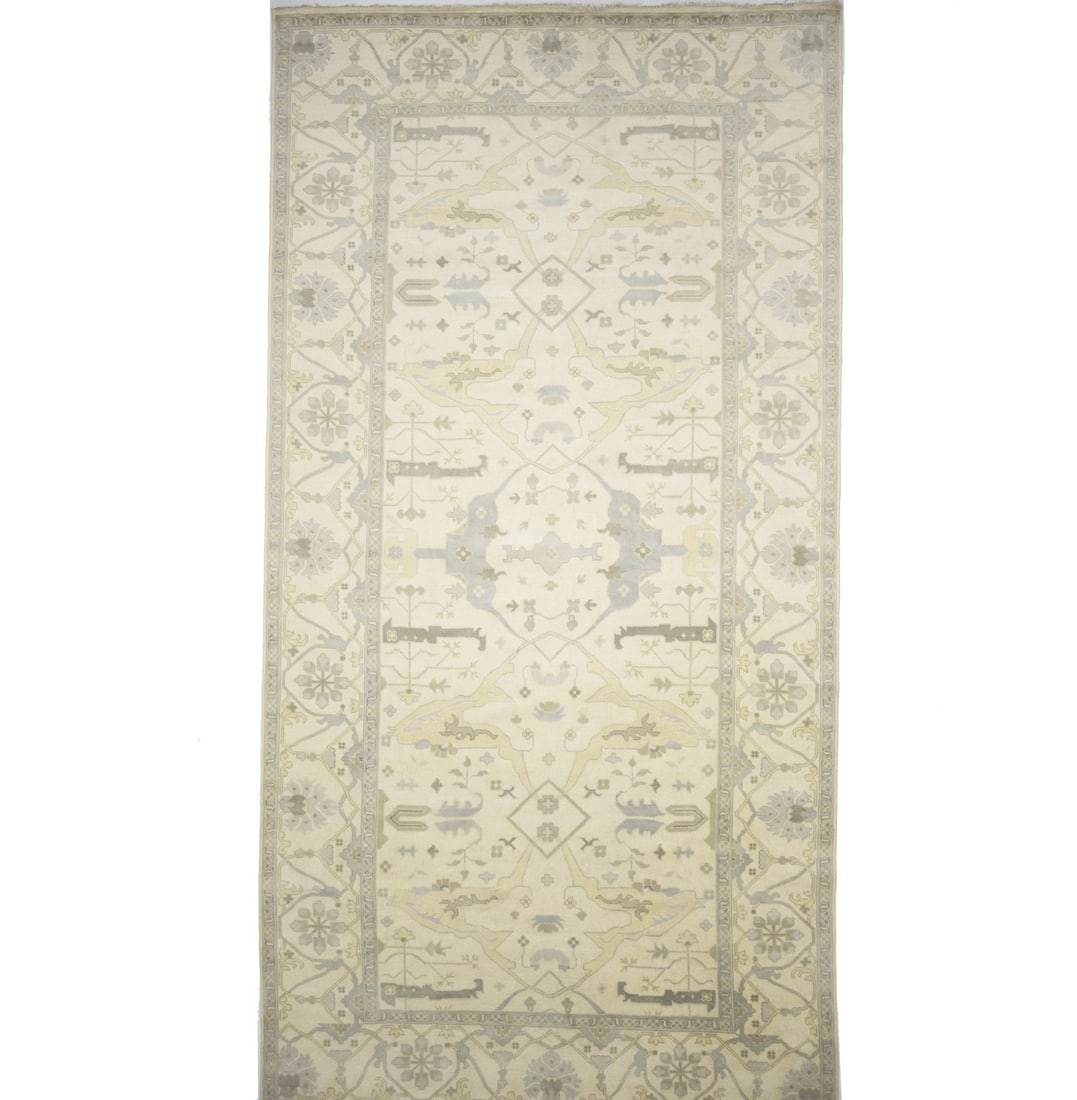 9'10 x 19'0 Hand-Knotted Wool Oushak Floral Rug in Muted Modern Tones: 9'10 x 19'0 Hand-Knotted Wool Oushak Floral Rug in Muted Modern Tones This oversized Oushak Oriental rug features a muted floral pattern in cream, pastel gray, pastel brown, and additional soft colors