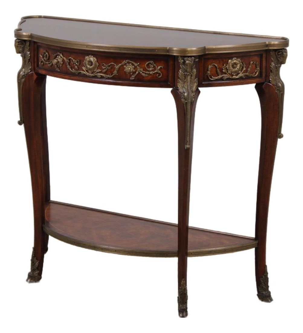 Theodore Alexander Mahogany Demilune Console Model 5300-089: Theodore Alexander Mahogany Demilune Console Model 5300-089 This Theodore Alexander demilune console features a two-tier design with Queen Anne legs and elegant French styling. Crafted from mahogany, 