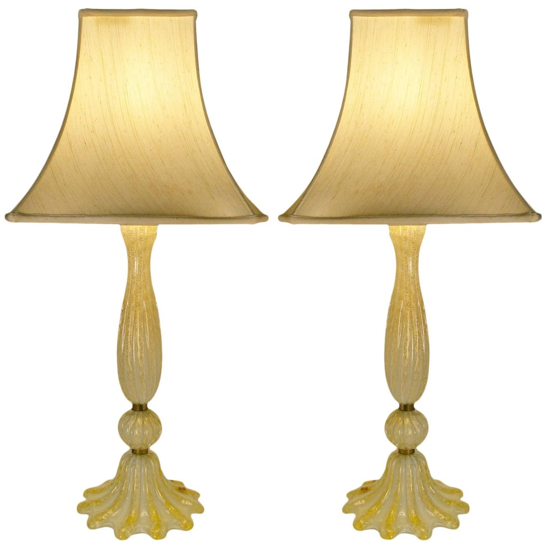 Elegant Pair of Gold Avventurina Murano Italian Table Lamps: Elegant Pair of Gold Avventurina Murano Italian Table Lamps This elegant pair of Murano Italian table lamps showcases the exquisite Avventurina technique, featuring stunning gold inclusions that enhan