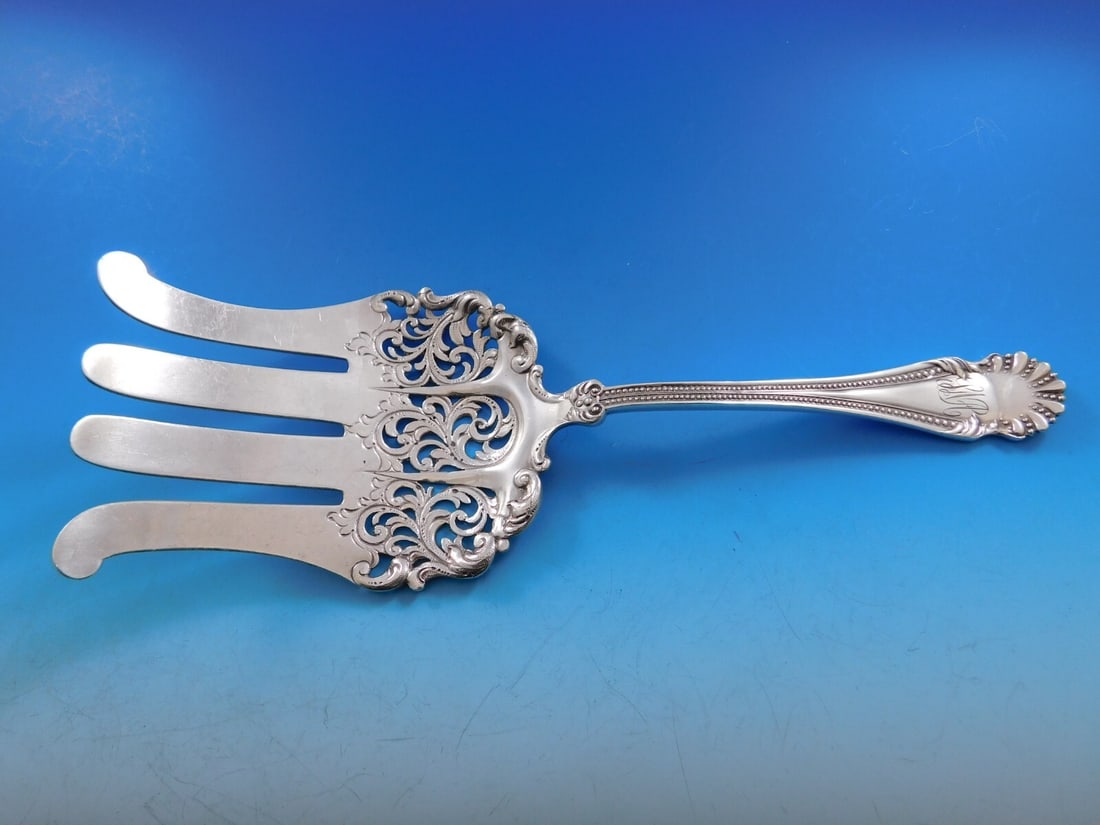 Hamilton & Davis 1895 Sterling Silver Pierced Asparagus Fork 10 Inch: Hamilton & Davis 1895 Sterling Silver Pierced Asparagus Fork 10 Inch Discover a piece of history with this Hamilton & Davis Sterling Silver Asparagus Fork. Crafted in 1895, this serving fork features 