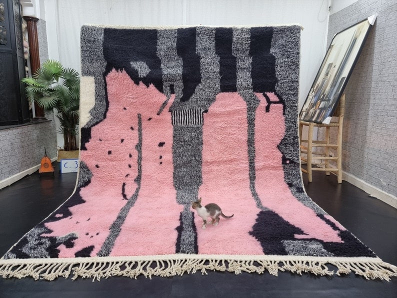 Handmade Moroccan Berber Wool Rug in Artistic Pink: Handmade Moroccan Berber Wool Rug in Artistic Pink Enhance your living space with this exquisite Artistic Pink Handmade Moroccan Berber Wool Rug. This stunning piece showcases a vibrant array of color