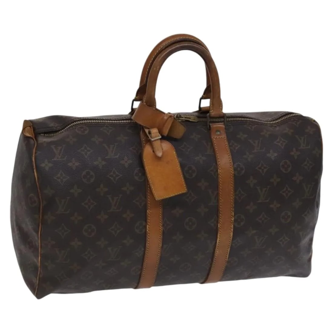 Keepall Travel Bag in Brown Monogram Canvas by Louis Vuitton: Keepall Travel Bag in Brown Monogram Canvas by Louis Vuitton This Louis Vuitton Keepall Bag features the iconic Monogram canvas in brown and is designed for unisex use. Made in France, the bag shows s
