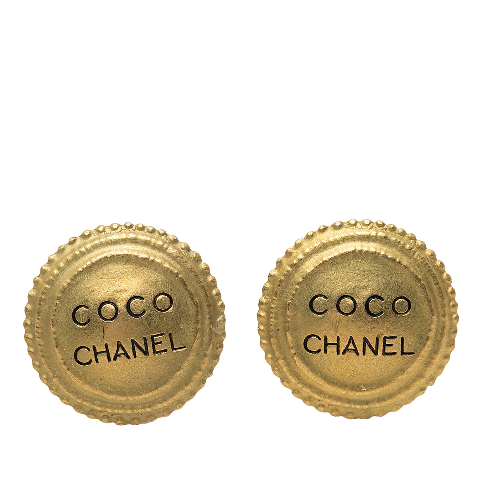 Chanel Coco Round Gold Plated Clip On Earrings: Chanel Coco Round Gold Plated Clip On Earrings These Chanel round clip-on earrings feature gold-plated metal bodies with secure back clip closures. Designed in a classic gold tone, they are a statemen
