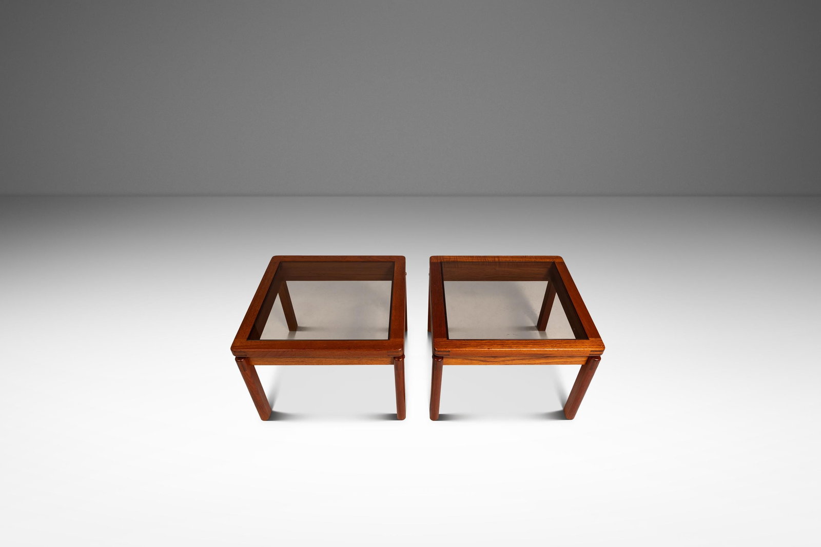 Set of 2 Teak and Smoked Glass Danish Modern End Tables by Kristiansen Thomassen: Set of 2 Teak and Smoked Glass Danish Modern End Tables by Kristiansen Thomassen This set of two Mid-Century Danish Modern end tables, designed by Kristiansen Thomassen and crafted in Denmark circa 19