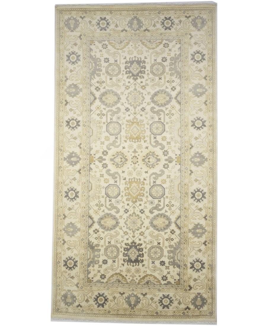 Handmade Wool Oushak Chobi Area Rug 9'1 X 17'8 Floral Pattern: Handmade Wool Oushak Chobi Area Rug 9'1 X 17'8 Floral Pattern This handmade Oushak Chobi area rug features a rare size and a muted floral pattern in cream, gray, and goldish beige tones. Crafted from 