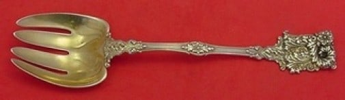 Tiffany & Co. Sterling Silver Gold Washed Buffet Fork 9 1/4 Unusual Design: Tiffany & Co. Sterling Silver Gold Washed Buffet Fork 9 1/4 Unusual Design This exquisite Tiffany & Co. buffet fork is crafted from sterling silver with a luxurious gold wash. Measuring 9 1/4 inches, 