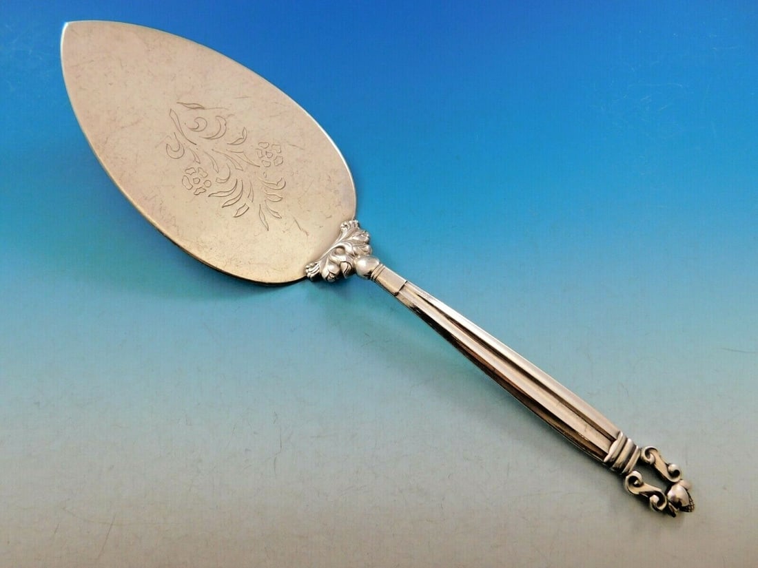 Georg Jensen Acorn Sterling Silver Large Pie Server 10 1/2": Georg Jensen Acorn Sterling Silver Large Pie Server 10 1/2" This exquisite pie server from the Acorn pattern by Georg Jensen is a testament to Scandinavian design excellence. Crafted from high-quality