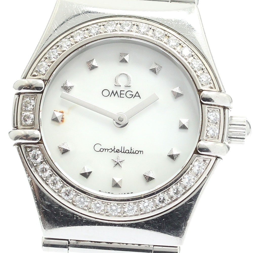 Omega Constellation 1465.71 Quartz Ladies Diamond Bezel Watch: Omega Constellation 1465.71 Quartz Ladies Diamond Bezel Watch This pre-owned OMEGA Constellation ladies wristwatch features a stainless steel case and band, highlighted by a diamond bezel and a white 
