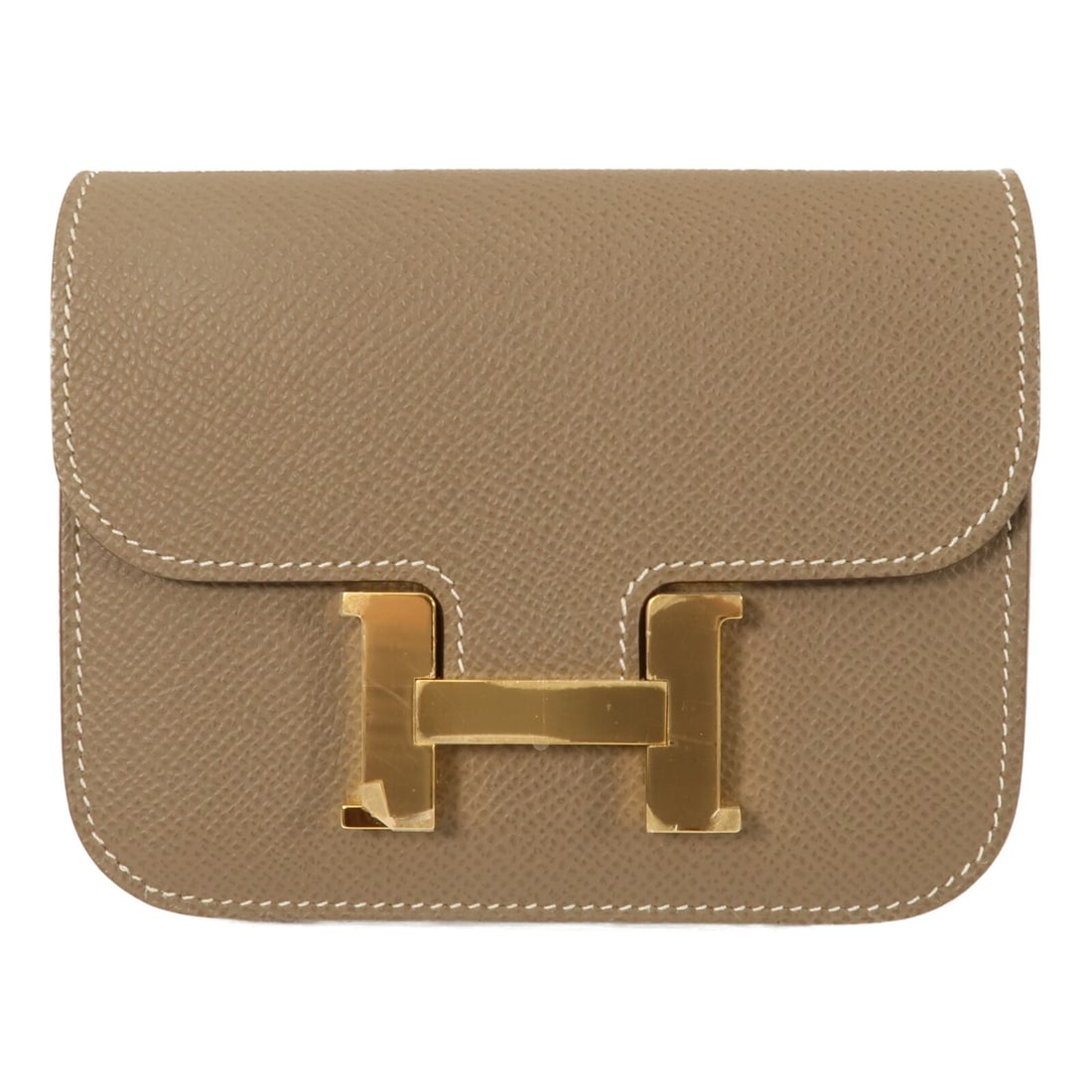 Hermes Constance Slim Epsom Leather Bi Fold Wallet Etoupe GHW: Hermes Constance Slim Epsom Leather Bi Fold Wallet Etoupe GHW This Hermes Constance Slim Wallet is crafted from Epsom calfskin leather in a sophisticated brown shade. Featuring a bi-fold design, it is