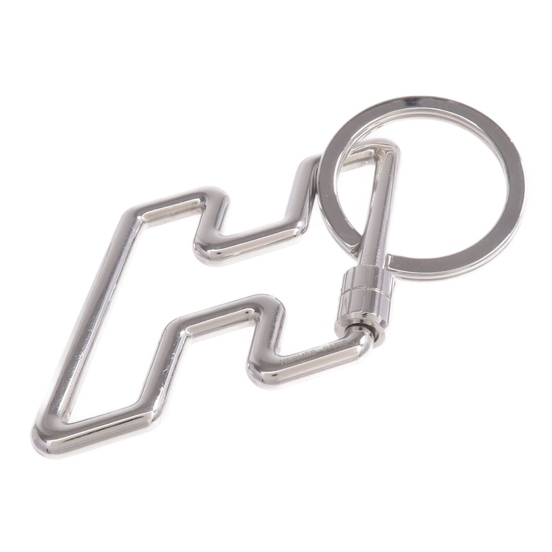 H Too Speed Silver Tone Metal Key Ring by Hermes: H Too Speed Silver Tone Metal Key Ring by Hermes This HERMES H Too Speed key ring features a sleek silver-tone metal design, crafted for a stylish and functional accessory. Designed for men, it offers