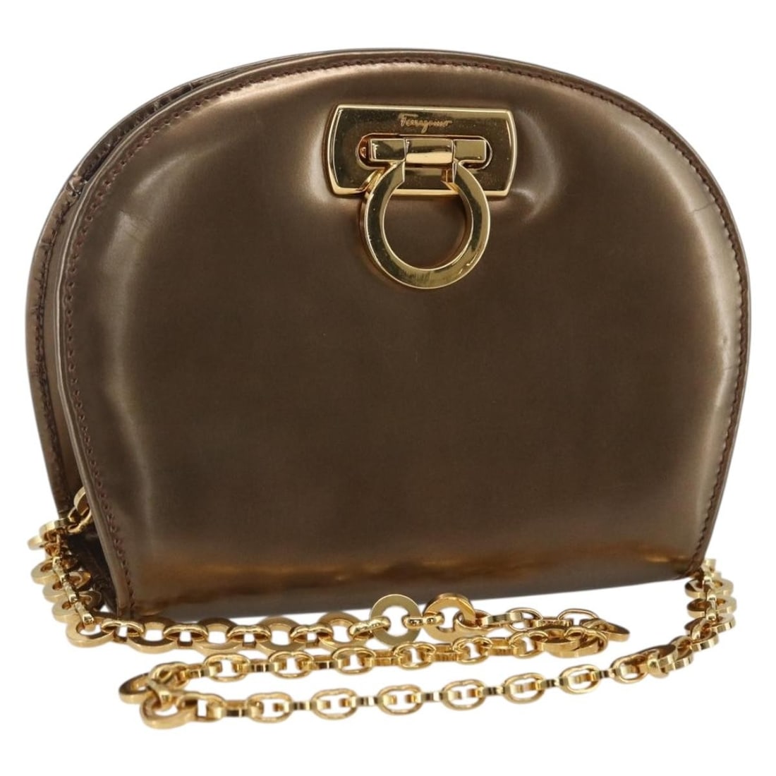 Patent Leather Gancini Shoulder Bag by Salvatore Ferragamo Gold Tone: Patent Leather Gancini Shoulder Bag by Salvatore Ferragamo Gold Tone This Salvatore Ferragamo shoulder bag features a gold patent leather exterior with a chain Gancini design. Made in Italy, the bag o