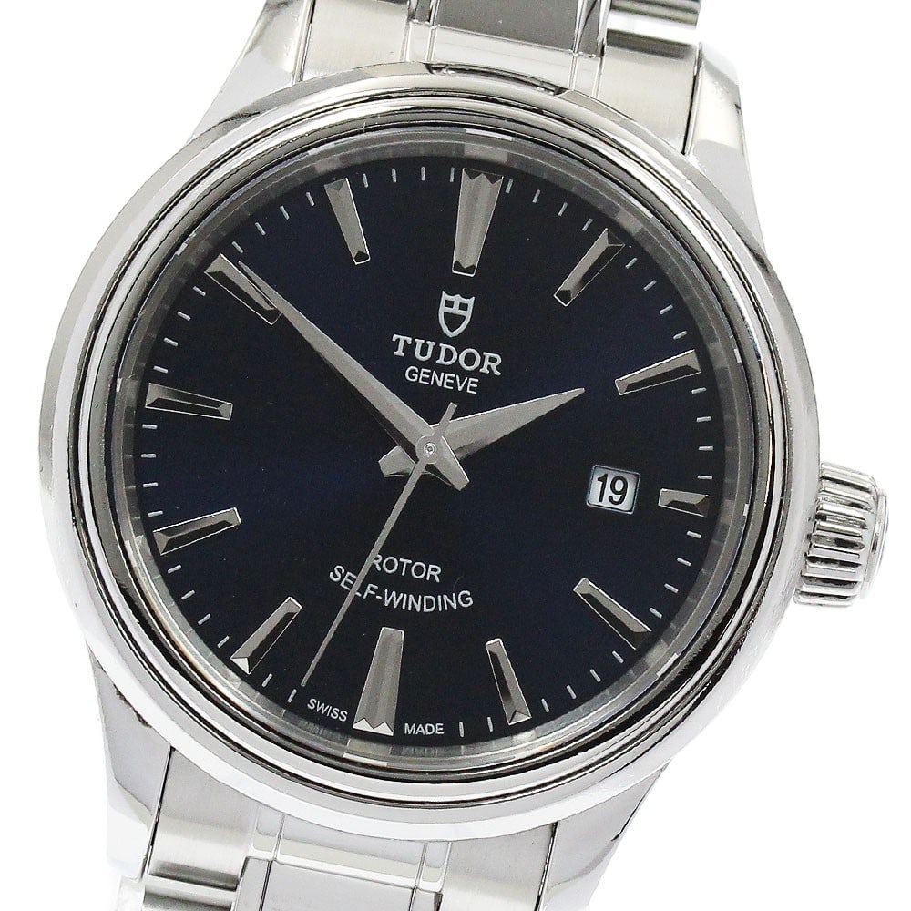 TUDOR Style 12100 Blue Dial Automatic Date Watch: TUDOR Style 12100 Blue Dial Automatic Date Watch This Tudor Style Date women's wristwatch features a stainless steel case and bracelet, complemented by a blue dial. The watch is powered by an automati