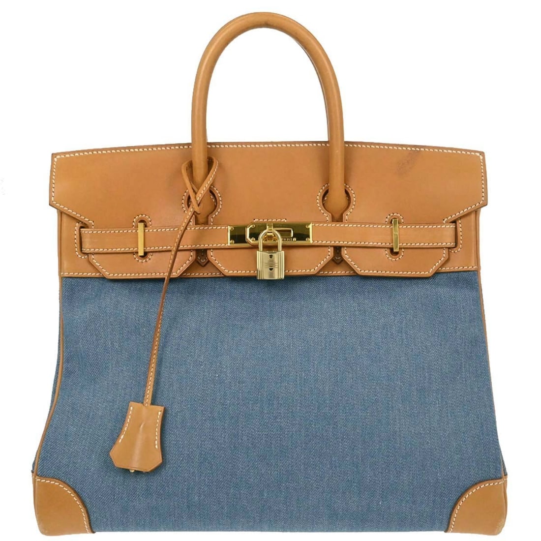 Hermes Haut a Courroies 32 Blue Toile Jean Vache Handbag: Hermes Haut a Courroies 32 Blue Toile Jean Vache Handbag Hermes Haut a Courroies 32 handbag in blue and natural Toile Jean and Vache leather. This medium handbag features double handles, a flap turnlo