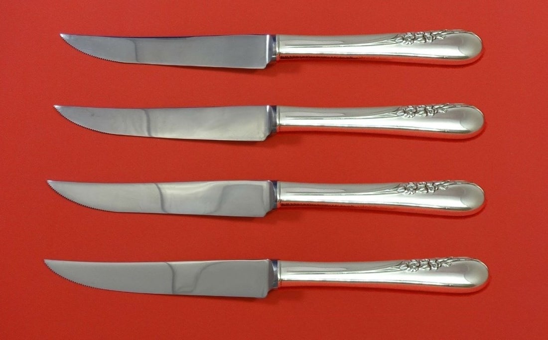 International Blossom Time Sterling Silver Steak Knife Set 4pc Custom: International Blossom Time Sterling Silver Steak Knife Set 4pc Custom Enhance your dining experience with this exquisite Blossom Time by International Sterling Silver Steak Knife Set. This 4-piece cus