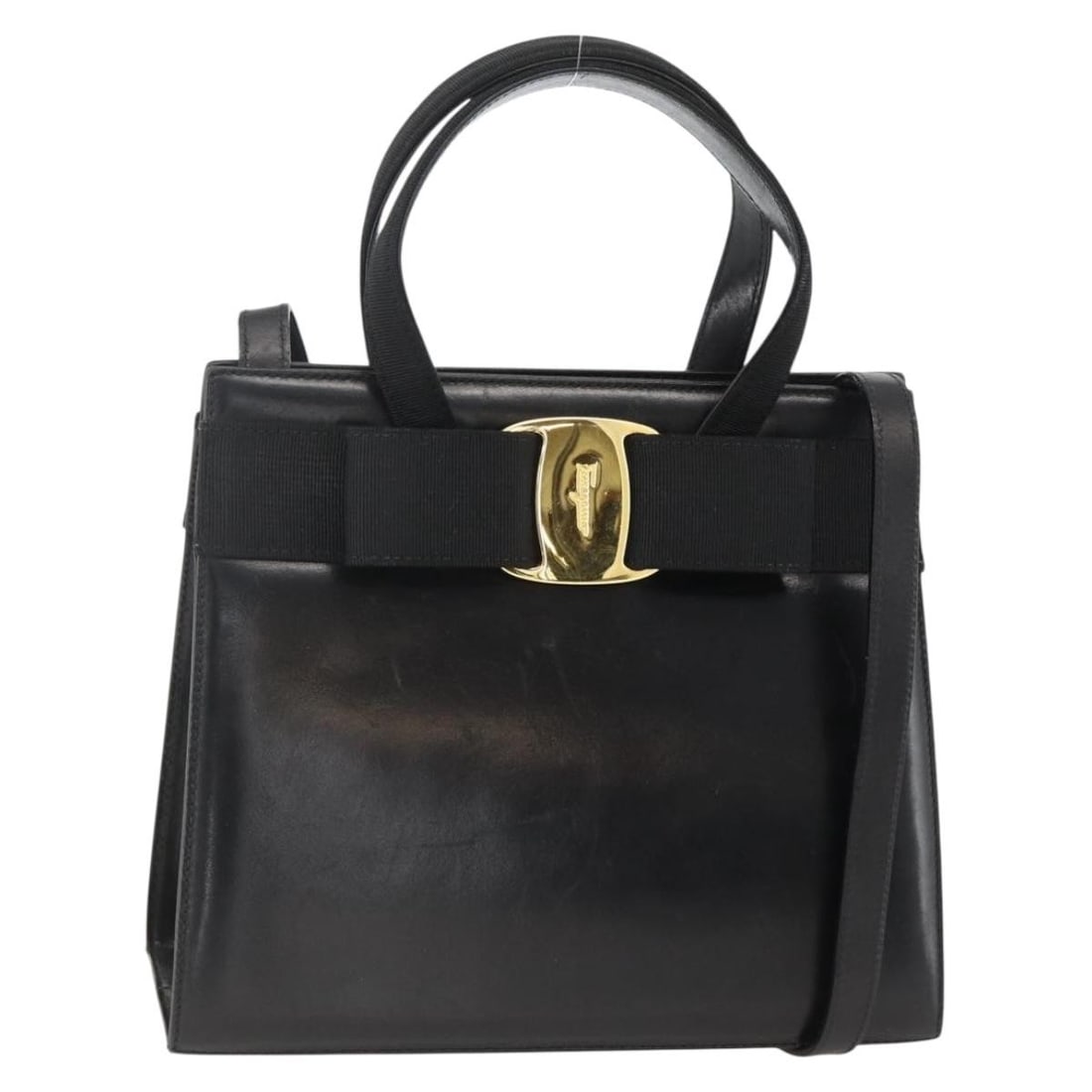 Salvatore Ferragamo Vala Black Leather Shoulder and Handbag with Ribbon Accent: Salvatore Ferragamo Vala Black Leather Shoulder and Handbag with Ribbon Accent This Salvatore Ferragamo Vala Ribbon handbag is crafted from black leather with gold-tone accents. Designed for women, it