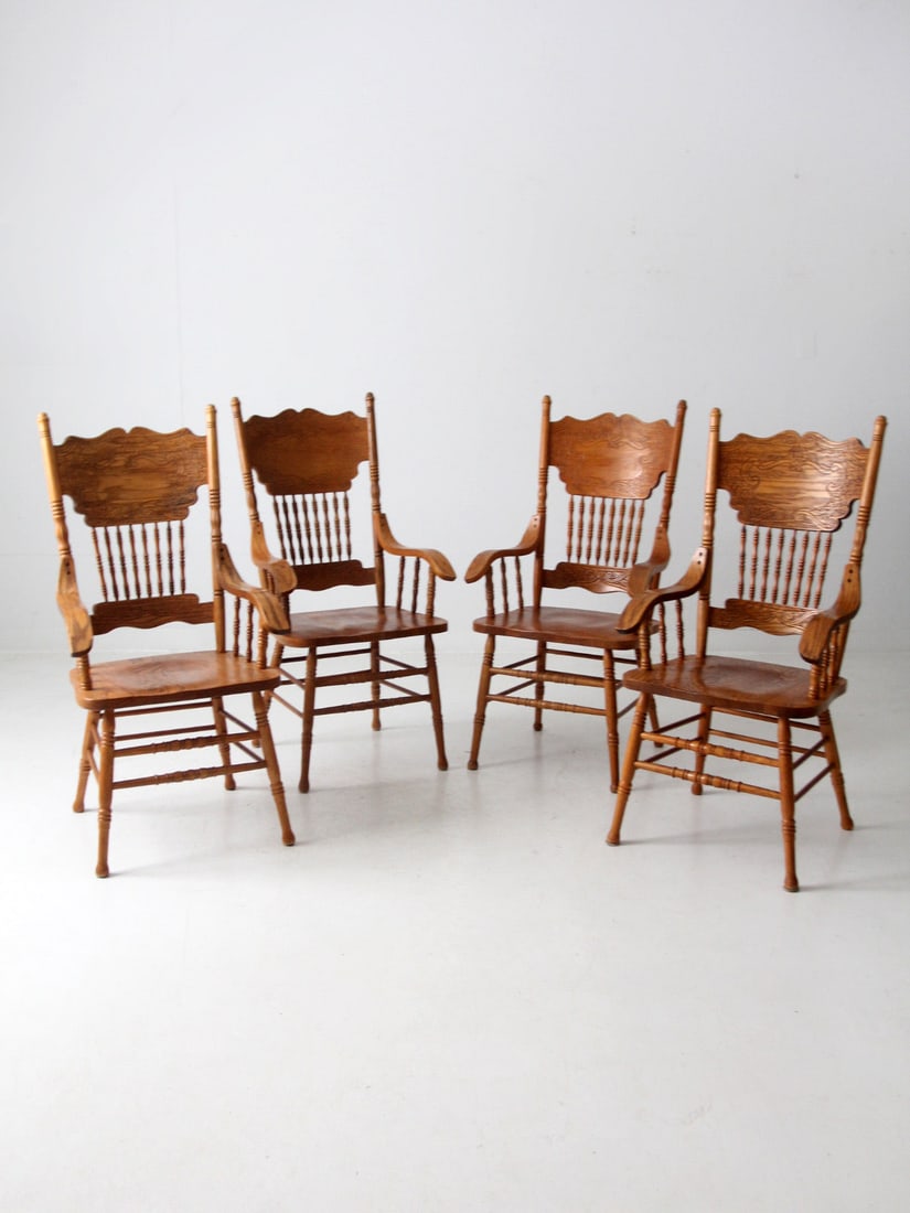Set of 4 Vintage Farmhouse Press Back Dining Chairs: Set of 4 Vintage Farmhouse Press Back Dining Chairs Enhance your dining space with this charming set of four vintage press back wood dining chairs. These farmhouse-style chairs showcase elegant bentwo