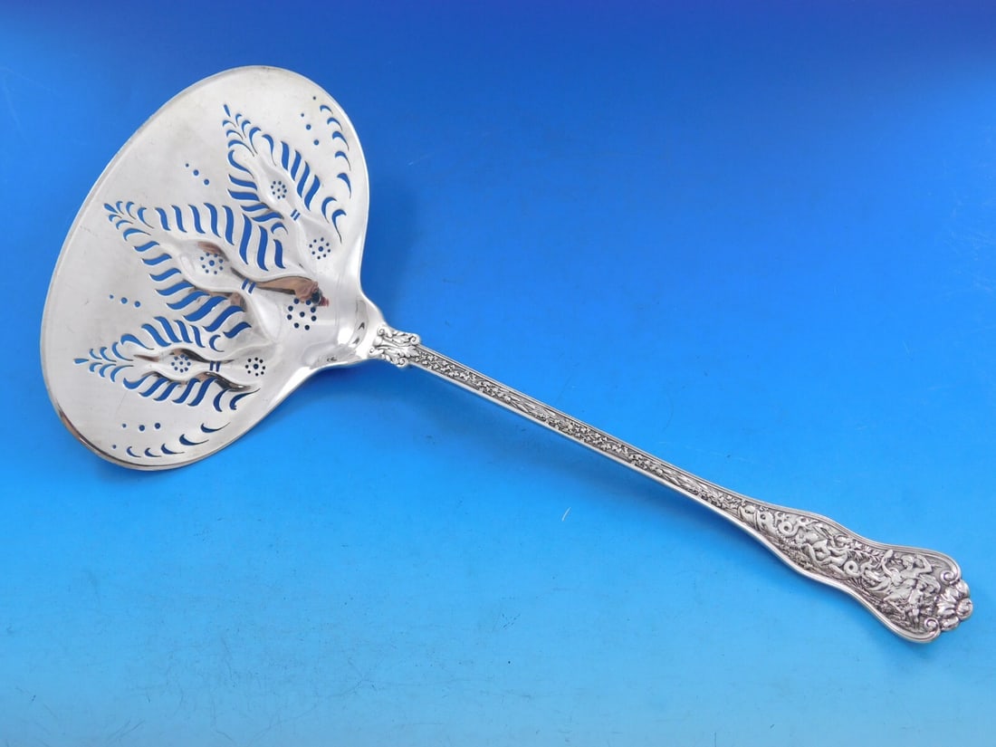 Rare Tiffany & Co Olympian Sterling Silver Fish Server 11 1/4": Rare Tiffany & Co Olympian Sterling Silver Fish Server 11 1/4" Discover the exquisite Olympian Fish Server by Tiffany & Co., a rare serving piece crafted in sterling silver. This remarkable item, meas