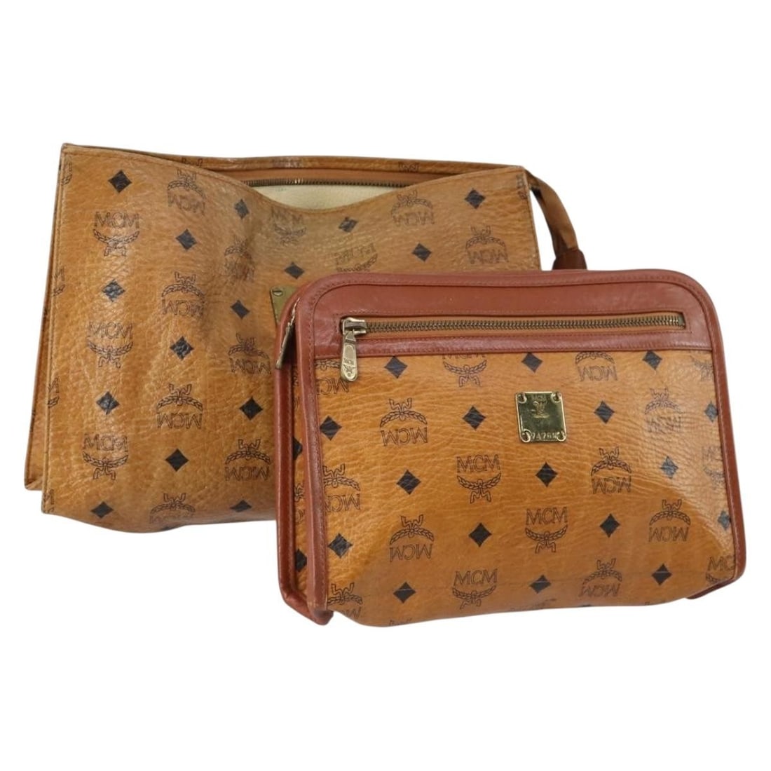 MCM Logogram Vicetos Clutch Bag PVC Leather Brown Auth 2 Set: MCM Logogram Vicetos Clutch Bag PVC Leather Brown Auth 2 Set This MCM Logogram Vicetos Clutch Bag is a stylish accessory crafted from durable PVC leather in a rich brown color. Made in Germany, this c