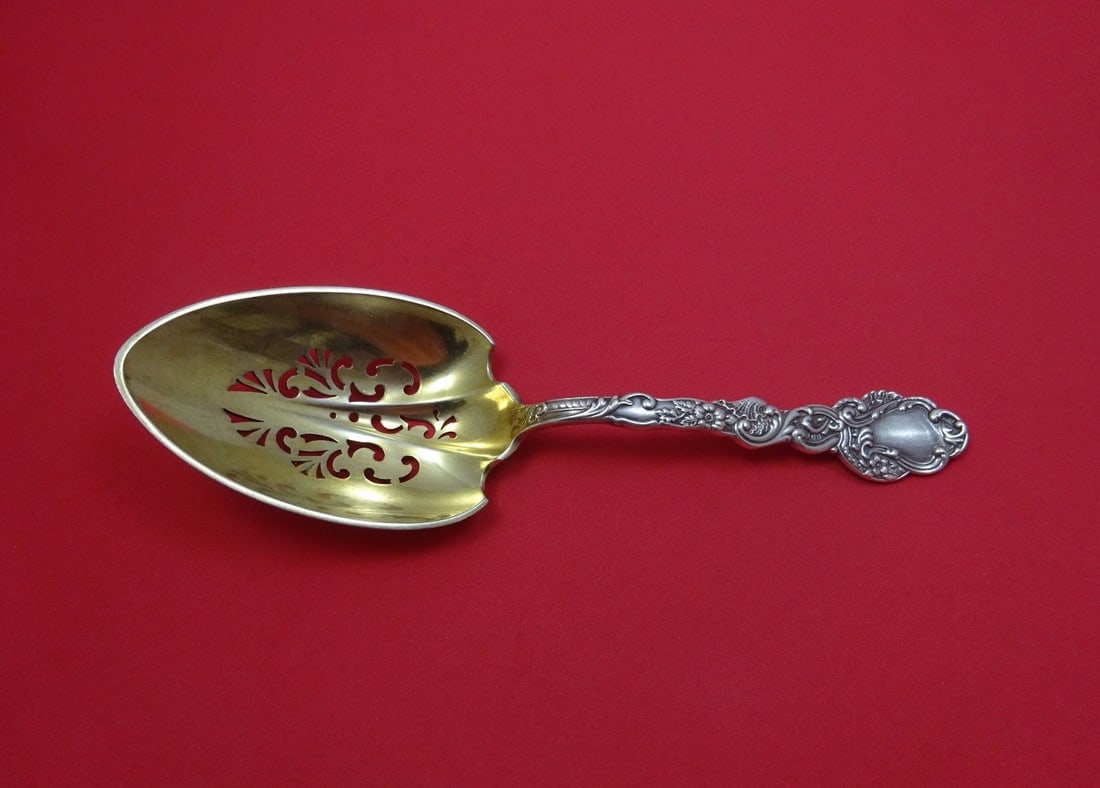 Gorham Marie Antoinette Sterling Silver Ice Spoon Gold Wash 9 1/4: Gorham Marie Antoinette Sterling Silver Ice Spoon Gold Wash 9 1/4 This exquisite ice spoon is crafted from high-quality sterling silver and features a luxurious gold wash finish. Designed in the elega
