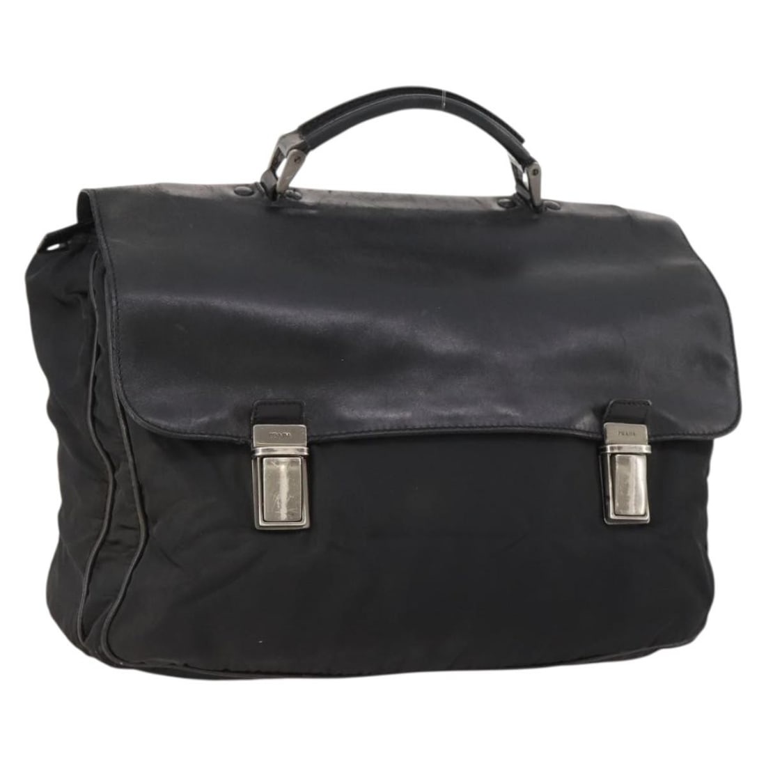 Prada Black Nylon Women's Handbag with Silver Accents Made in Italy: Prada Black Nylon Women's Handbag with Silver Accents Made in Italy This PRADA handbag is crafted from black nylon with silver-tone accents, designed for women. The bag features a spacious interior an