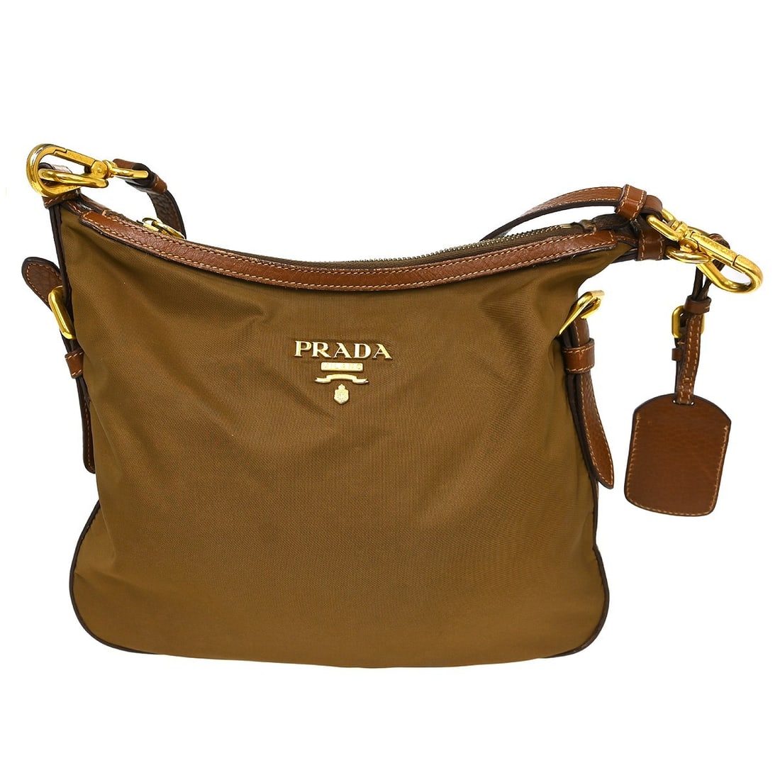PRADA Nylon Medium Shoulder Bag Brown with Name Tag: PRADA Nylon Medium Shoulder Bag Brown with Name Tag Prada shoulder bag in brown nylon with leather trim and a brown shoulder strap. This medium bag features a slim profile, one interior zipper pocket,