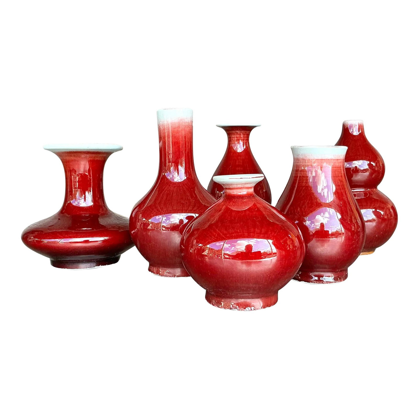Collection of 6 Vintage Asian Sang de Beauf Glazed Ceramic Vases: Collection of 6 Vintage Asian Sang de Beauf Glazed Ceramic Vases Enhance your home with this captivating collection of six Vintage Asian Sang de Boeuf Glazed Ceramic Vases. Renowned for their rich, de