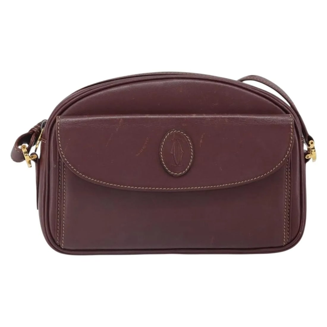 Cartier Must de Cartier Burgundy Leather Shoulder Bag: Cartier Must de Cartier Burgundy Leather Shoulder Bag This Must de Cartier shoulder bag for women features burgundy leather with a classic design. It shows signs of wear including surface rubbing, sli