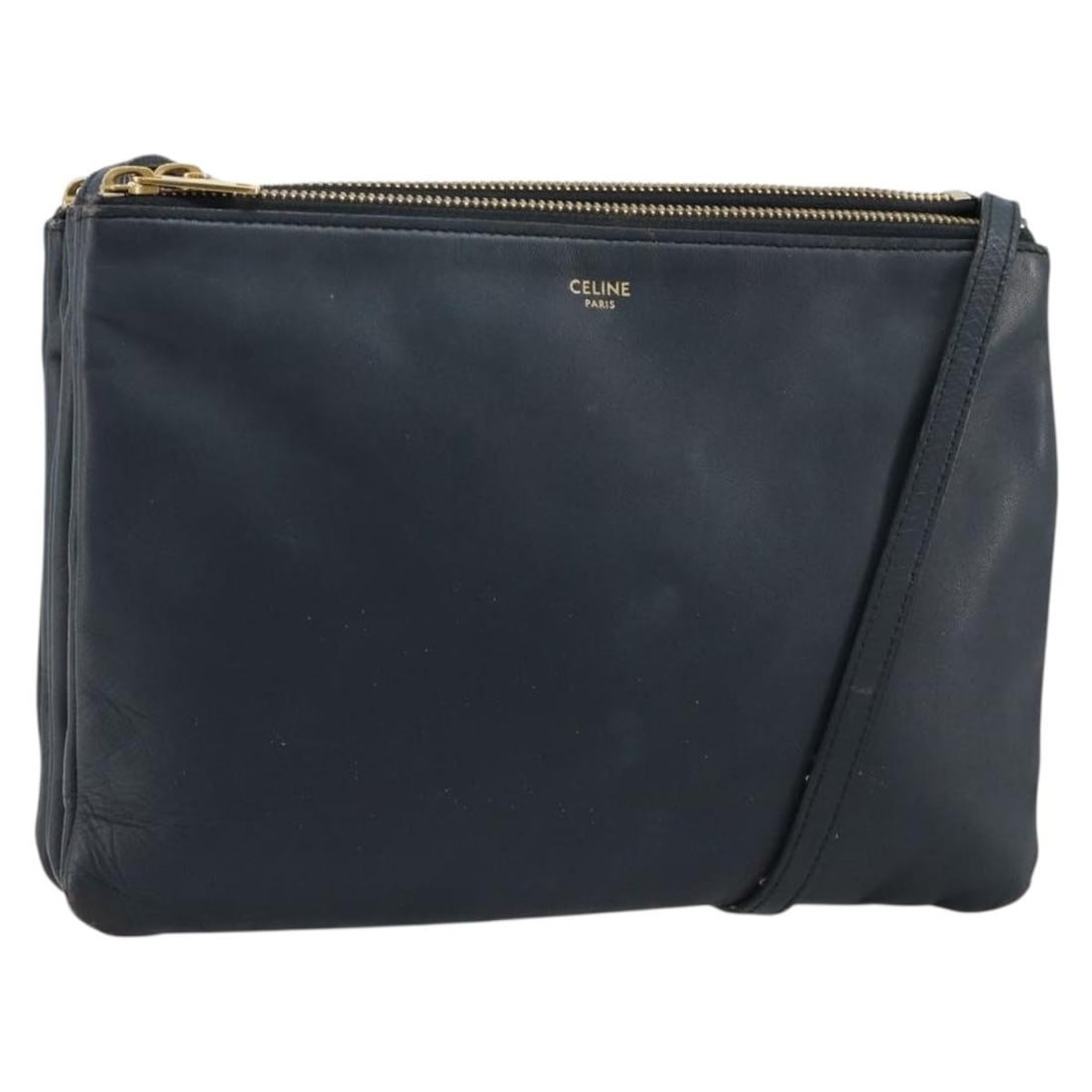 CELINE Trio leather navy gold shoulder bag Italy: CELINE Trio leather navy gold shoulder bag Italy This CELINE Trio Shoulder Bag is crafted from navy leather with gold accents and features an adjustable shoulder strap. Made in Italy, it is designed f