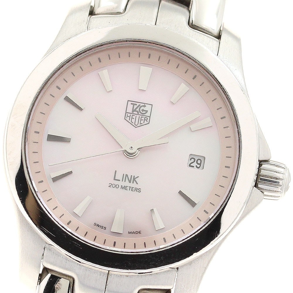TAG Heuer Link Quartz Pink Shell Date Watch WJF1312: TAG Heuer Link Quartz Pink Shell Date Watch WJF1312 This TAG HEUER Link Date Quartz women's wristwatch features a stainless steel case and bracelet with a distinctive pink shell dial. The watch includ