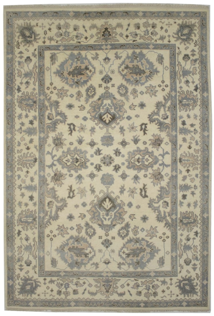 Wool Area Rug 6'1 x 8'10 Hand-Knotted Floral Cream Oushak Chobi Design: Wool Area Rug 6'1 x 8'10 Hand-Knotted Floral Cream Oushak Chobi Design This handmade area rug features a muted cream, gray, and beige color palette with a floral pattern, offering a blend of modern an
