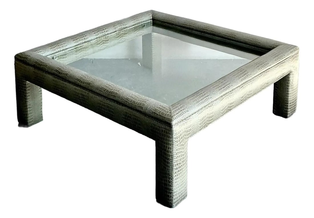 Postmodern Crocodile Embossed Square Coffee Table with Cylindrical Legs 48.5": Postmodern Crocodile Embossed Square Coffee Table with Cylindrical Legs 48.5" This vintage coffee table is a striking example of Postmodern 1980s design, featuring a bold square frame with cylindrical