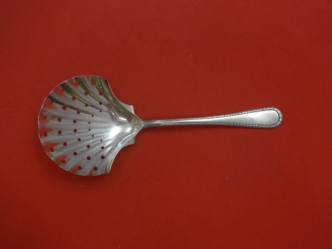 Buccellati Feather Edge Sterling Silver Serving Spoon 8 1/4": Buccellati Feather Edge Sterling Silver Serving Spoon 8 1/4" This exquisite serving spoon, known as the Feather Edge or Italian Feather Edge, is crafted by Buccellati from high-quality sterling silver
