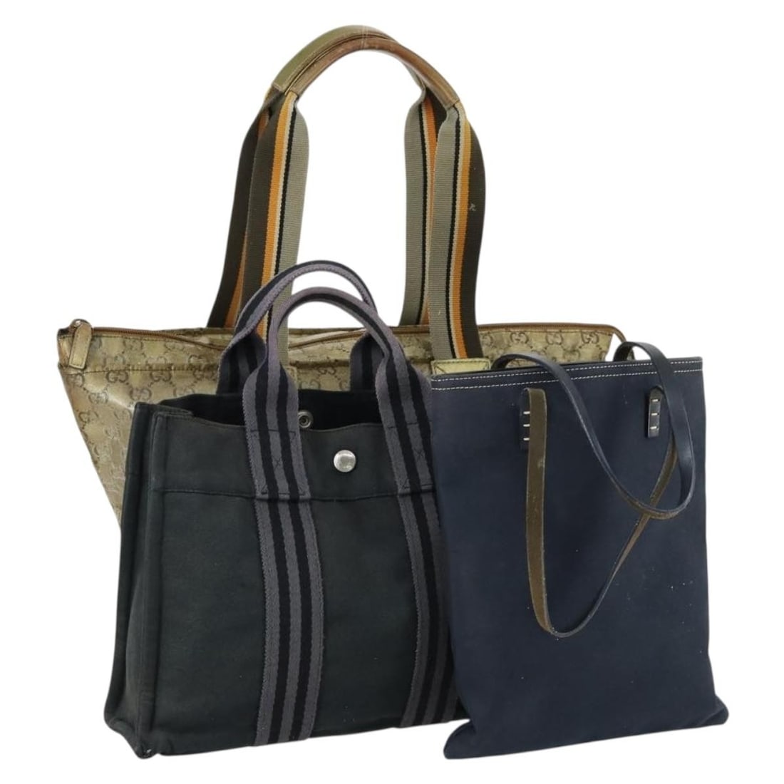 Three Piece FENDI Canvas Handbag Set in Black and Beige: Three Piece FENDI Canvas Handbag Set in Black and Beige This set includes three heavily used hand bags from FENDI, Gucci, and Hermes. The bags feature canvas and GG canvas materials in black and beige