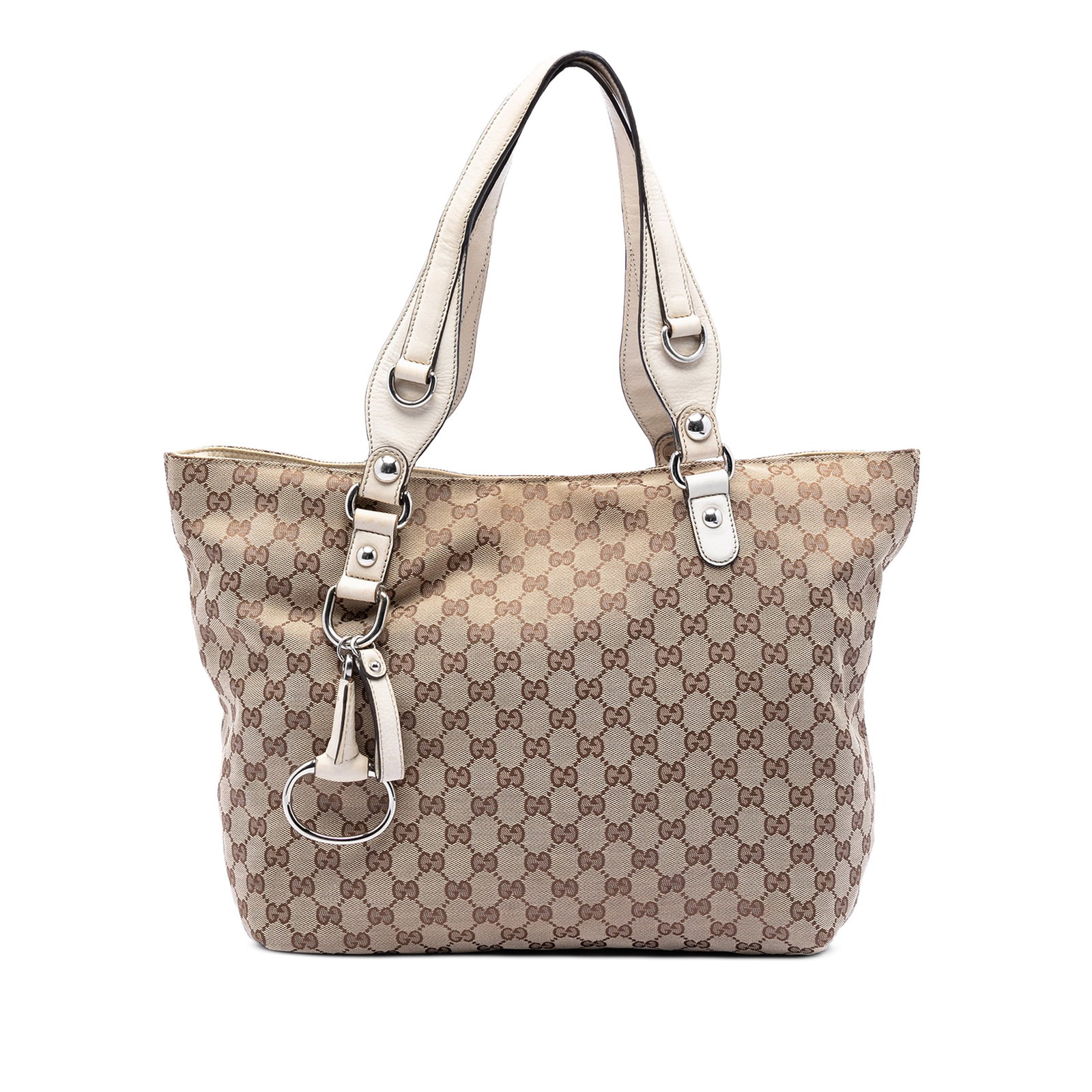 Gucci beige canvas tote with leather trim and magnetic snap closure: Gucci beige canvas tote with leather trim and magnetic snap closure This Gucci GG Canvas Icon Bit Tote features a beige canvas body with leather trim and flat leather straps. The bag is designed with 