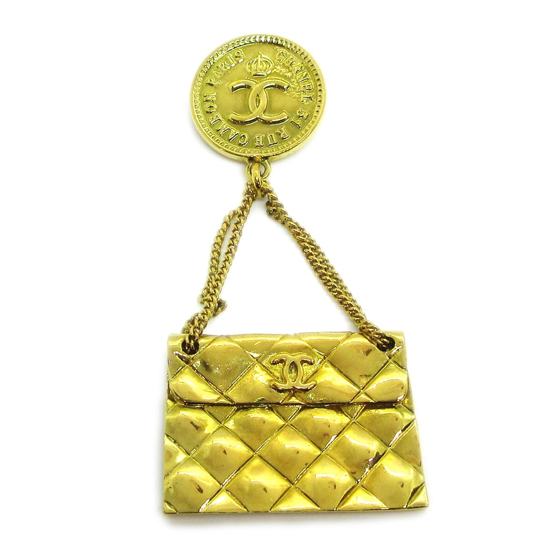 Chanel 95P Gold Tone Quilted Bag Motif Brooch Pin: Chanel 95P Gold Tone Quilted Bag Motif Brooch Pin Gold-tone brooch pin featuring a quilted bag motif. Made in France, this piece has a handbag-inspired design with Chanel styling and shows reasonable 