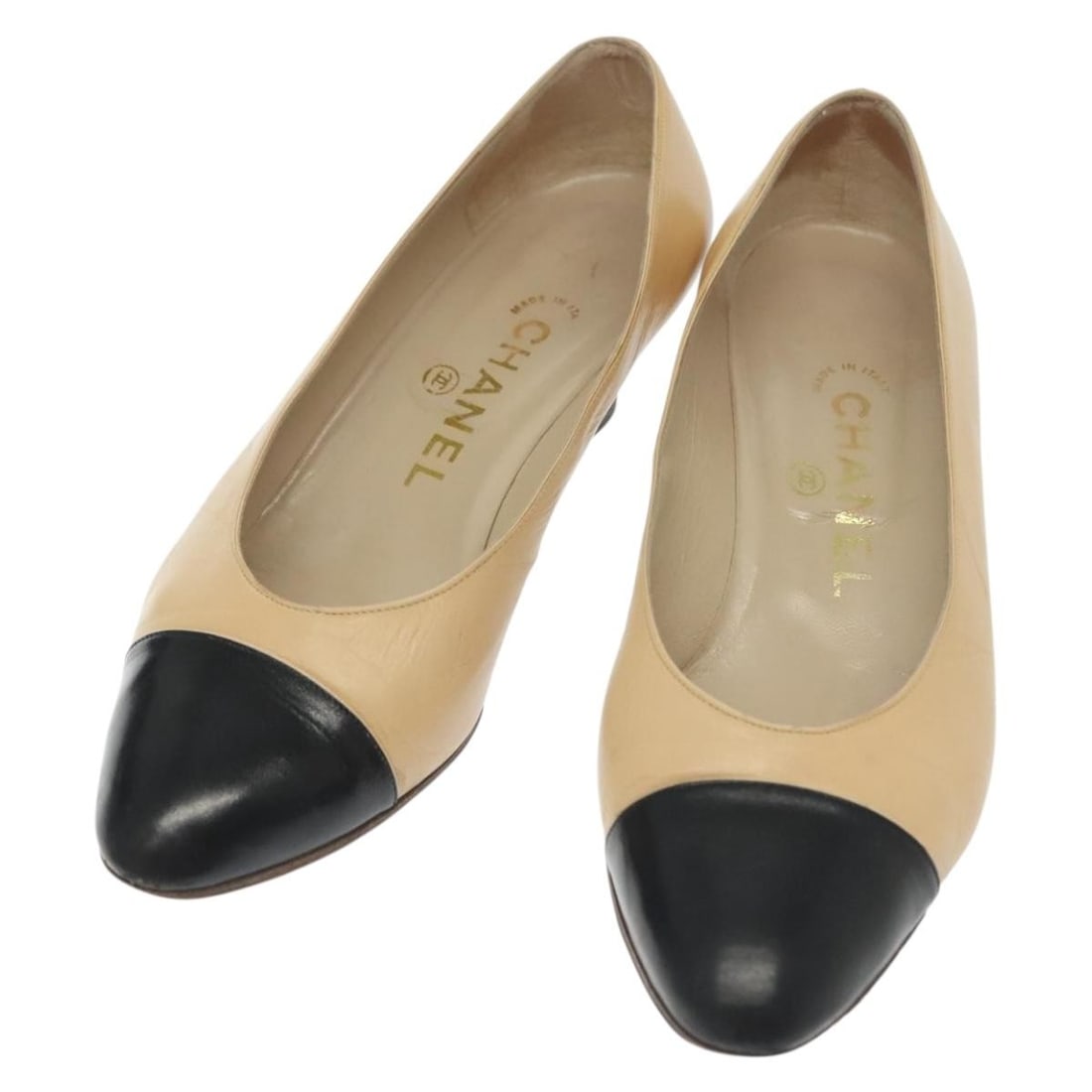 CHANEL Beige Leather High Heel Pumps Made in Italy: CHANEL Beige Leather High Heel Pumps Made in Italy Elevate your style with these authentic CHANEL high heel pumps, crafted in Italy from premium beige leather. These elegant shoes feature a comfortabl