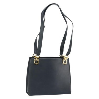 Salvatore Ferragamo Gancini Leather Tote in Navy with Gold Tone: Salvatore Ferragamo Gancini Leather Tote in Navy with Gold Tone Salvatore Ferragamo Gancini tote bag in navy leather with gold-tone accents. Made in Italy, this tote has a heavily used condition with 
